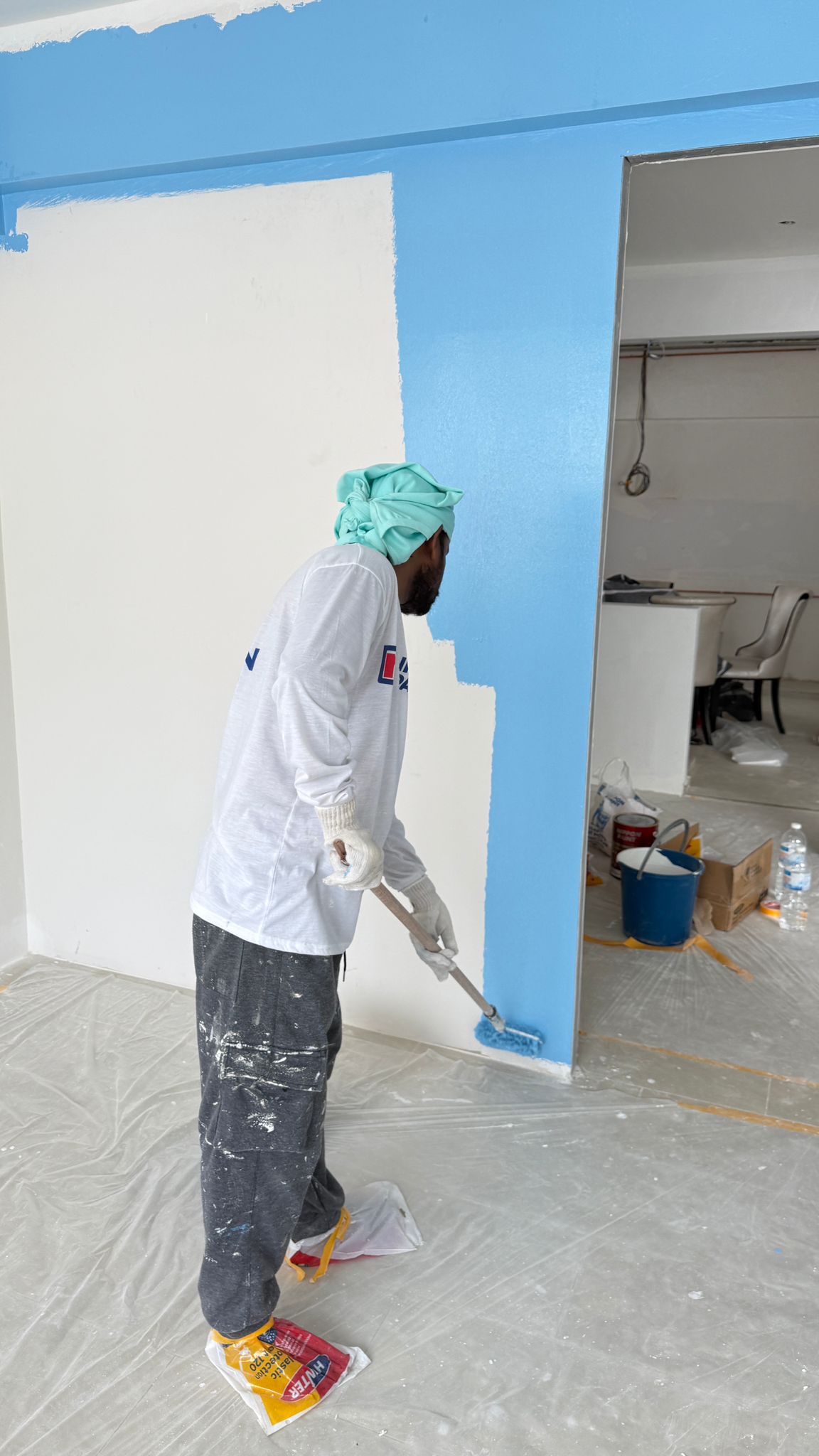 Professional painter carrying out interior painting work in Singapore